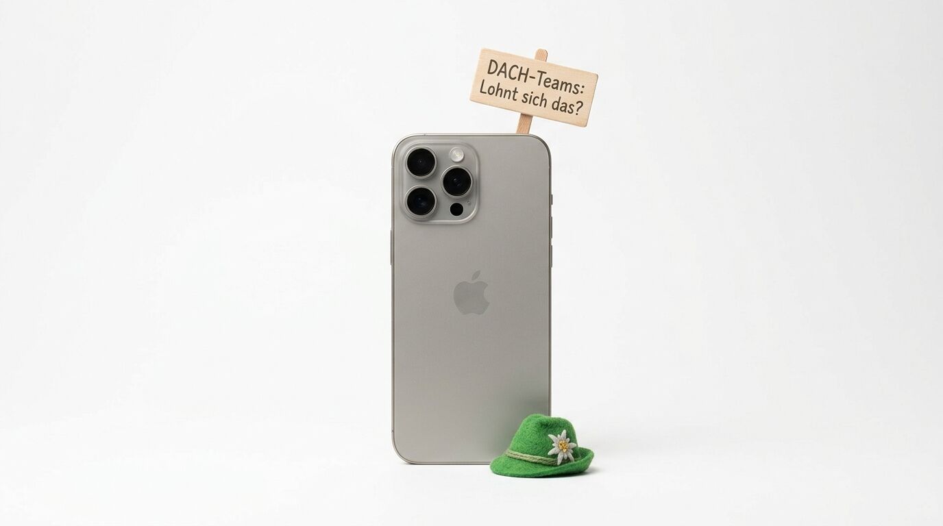 Graues Smartphone mit kleinem grünen Trachtenhut und Schild mit deutscher Aufschrift