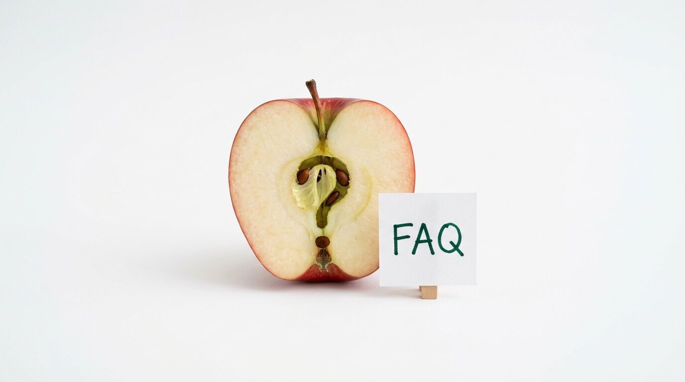 Halbierter Apfel mit Fragezeichen im Gehäuse und Zettel mit der Aufschrift „FAQ“ daneben