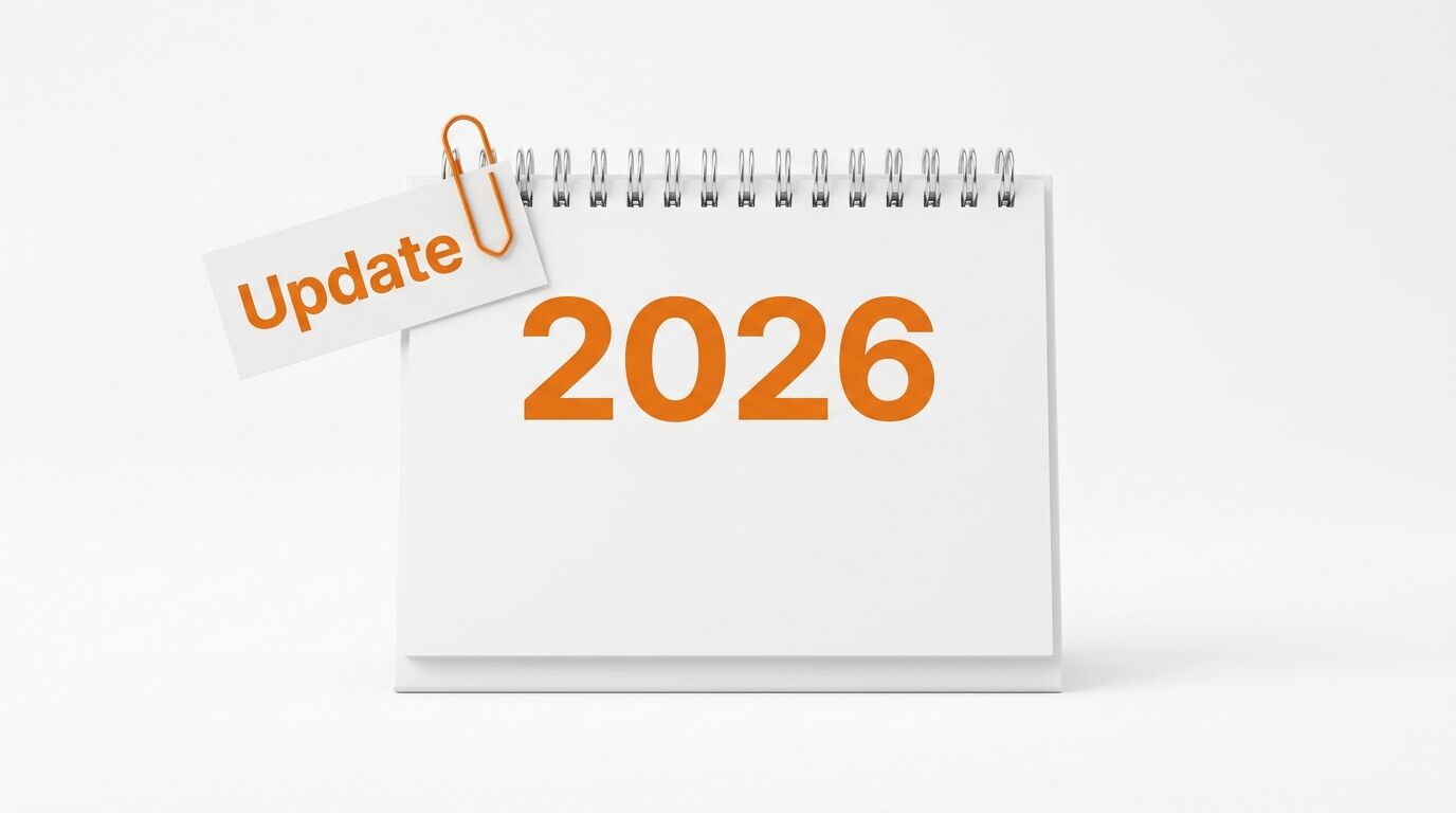 Weißer Spiralkalender mit orangefarbenem „2026“ und angeheftetem Zettel „Update“