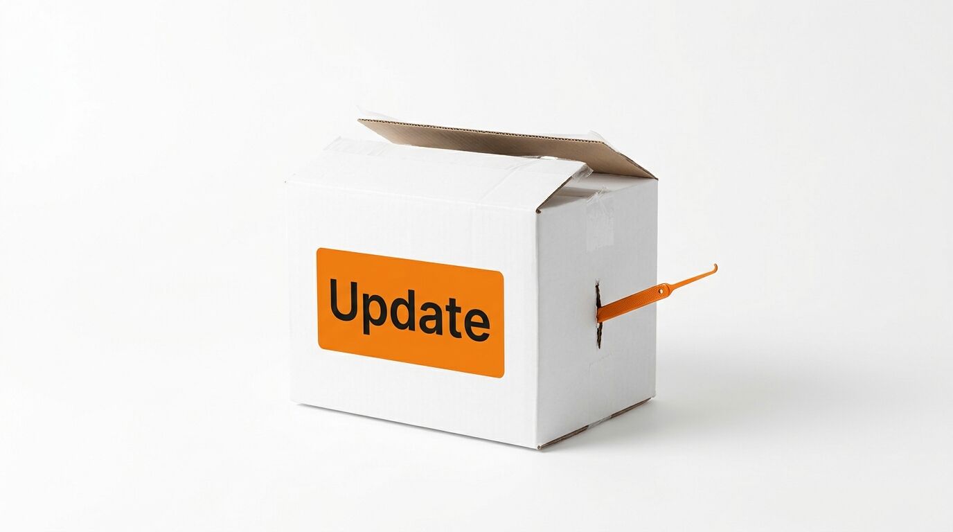 Weißer Karton mit orangefarbenem „Update“-Aufkleber und einem Dietrich, der aus der Seite ragt